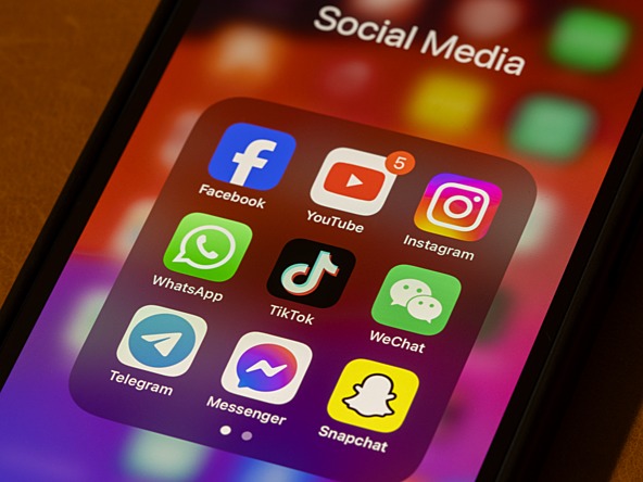 phone screen showing social media icons - facebook, youtube, tiktok, instagram etc